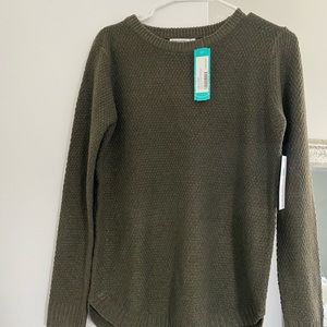 Green Sweater tags on